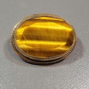 Antique brooch tigers eye stone gold filled faceted stone