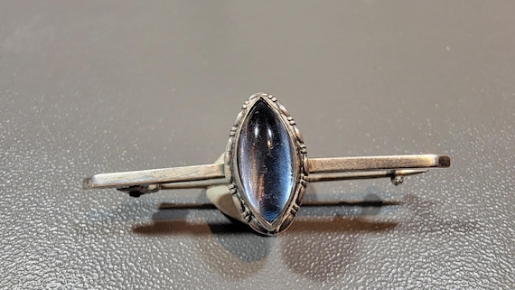 antique brooch blue glass stone marquise cabochon sterling silver setting simple edwardian style