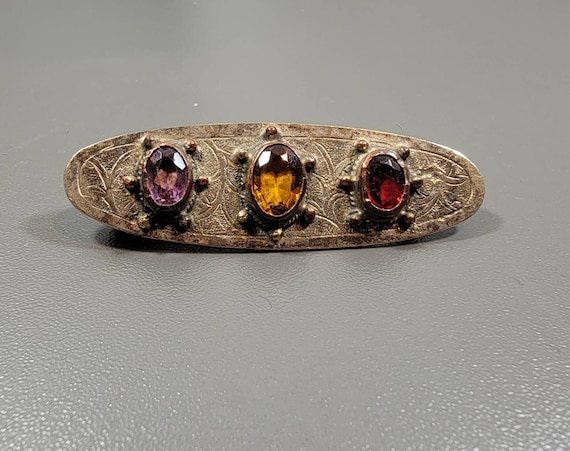 art deco brooch red purple yellow stones