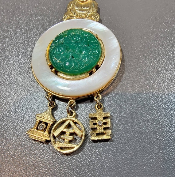 Buddha necklace gold tone green glass rhinestone and mother of pearl