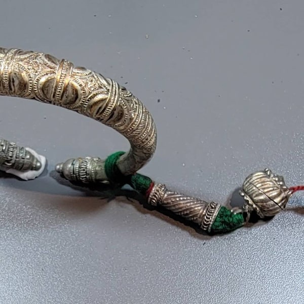 tribal bracelet cuff white base metal silver tone silver and wool tassel