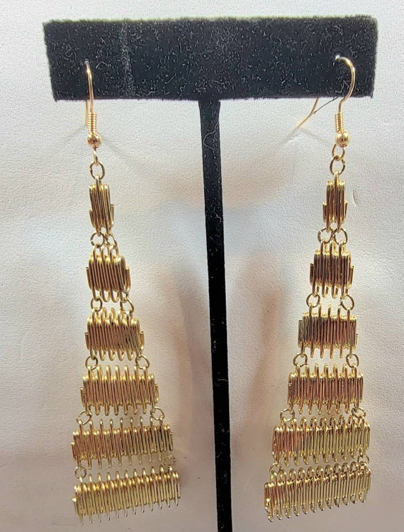 gold tone metal earrings extra long dangles
