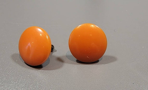 Bakelite earrings button shaped earrings screw on sterling orange butterscotch color