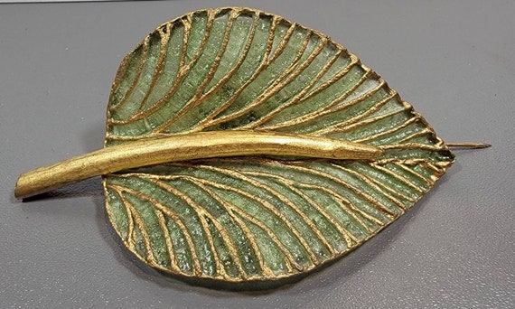 french plastic brooch cilea  green and gold plastic brooch