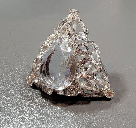 Schreiner style brooch clear stones triangular shaped layered silver tone metal  Circa 1960
