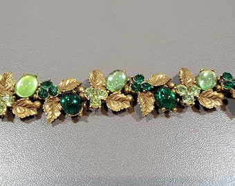 green rhinestone bracelet goldtone links and setting flower shaped