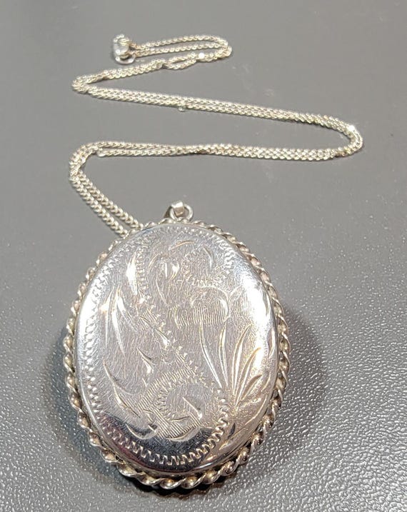 sterling silver locket engraved oval with twisted wire frame room for memento