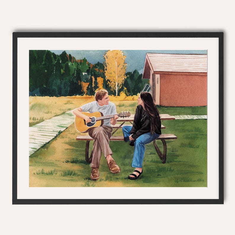May include: Watercolour painting of two people on a picnic table. One person is playing an acoustic guitar, while the other person is listening. The scene is set outdoors with trees, grass, and a small building in the background. The artwork is framed in a black border.