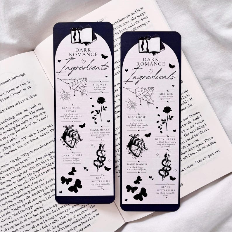 May include: Two black bookmark designs with a dark romance theme. Each bookmark features a black heart, black rose, black dagger, black butterflies, and a spider web with the text "Dark Romance Ingredients".