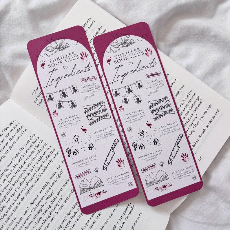 May include: Two pink bookmarks with a thriller book club theme. The bookmarks feature a list of "ingredients" for a mystery, including suspects, hand prints, a murder weapon, crime scene caution tape, and a thriller book. The bookmarks are decorated with red blood splatter.