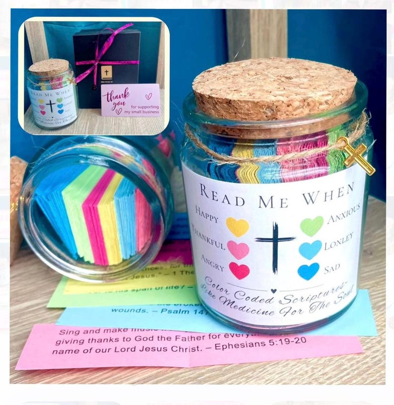 May include: A glass jar with a cork lid and a decorative cross charm. The jar is labeled "Read Me When" and contains colorful, color-coded scripture notes. The jar is a unique gift idea.