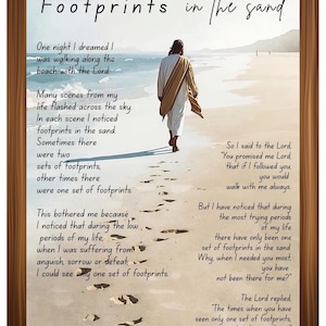 May include: Framed artwork with the text "Footprints in the sand" and a figure walking on a beach. The image includes a poem about faith and perseverance, set within a brown wooden frame.