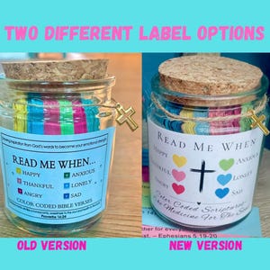 May include: Two glass jars with cork lids and gold cross charms. Each jar contains colorful paper strips and labels with the text "Read Me When..." and various emotions. One label says "Color Coded Bible Verses."