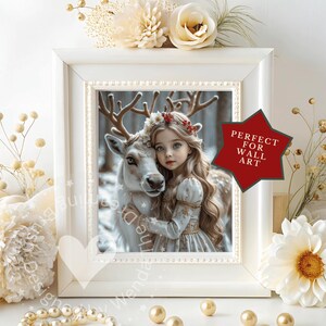 May include: A framed print featuring a young girl with long blonde hair and a reindeer. The girl wears a light blue dress and a floral crown. The print is in a white frame with a decorative border. A red star-shaped sticker reads "PERFECT FOR WALL ART".