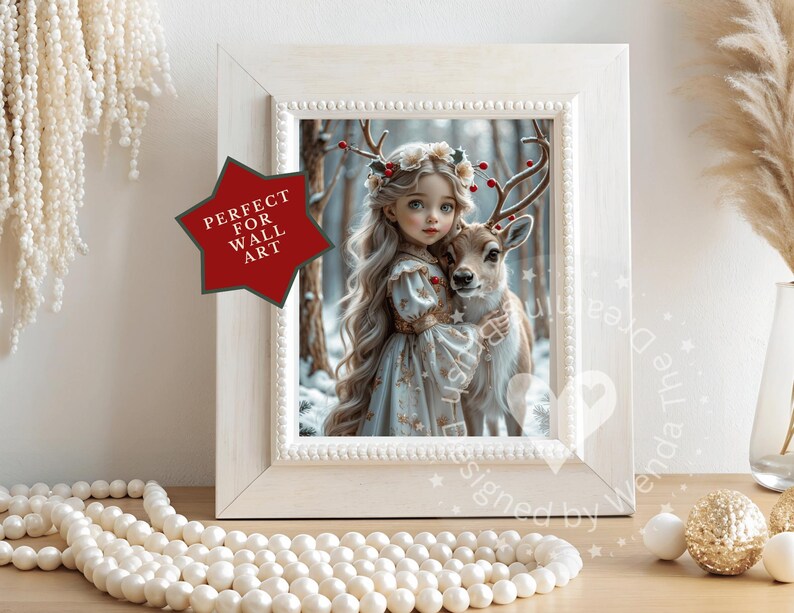 May include: A framed print featuring a young girl with long blonde hair and a deer in a snowy forest. The print is in a white frame with a beaded border. A red star-shaped graphic reads "PERFECT FOR WALL ART".