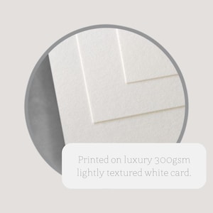 May include: Close-up of white, lightly textured cardstock. The text reads: "Printed on luxury 300gsm lightly textured white card."