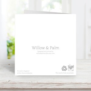 May include: A white greeting card with the text "Willow & Palm" in a delicate font. The card also includes the text "Designed and printed by willowpalmstudio.etsy.com" and "Printed in England within the southdowns". A recycling symbol is also present.