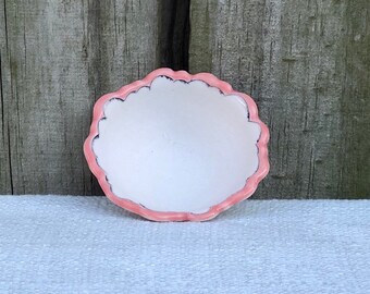 Charming ring dish with carved rim and inlaid whimsical design and pink and clear glaze