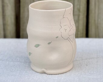 Porcelain tumbler with tree with falling green leaves inlaid design, cup with finger indention