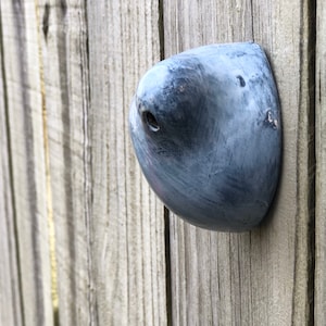 Gray ceramic wall pod sculpture