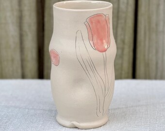 Porcelain tumbler with pink tulip inlay design, cup with finger indention