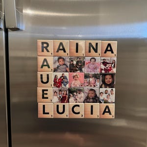 May include: A wooden tile set spelling out the names "Raina" and "Lucia" with photos of children on each tile.