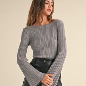 Ribbed long sleeve knitted top with stylishly flared arms