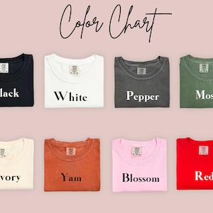 May include: Colour chart showing ten different t-shirt colours: Black, White, Pepper, Moss, Ivory, Yam, Blossom, Red, Navy, and Heather Grey.