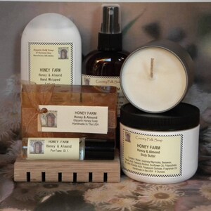 May include: A set of honey and almond scented bath and body products from Country Folk Soap. The set includes a hand-whipped lotion, glycerin honey soap, body butter, perfume oil, and a candle. All products are handmade in the USA.
