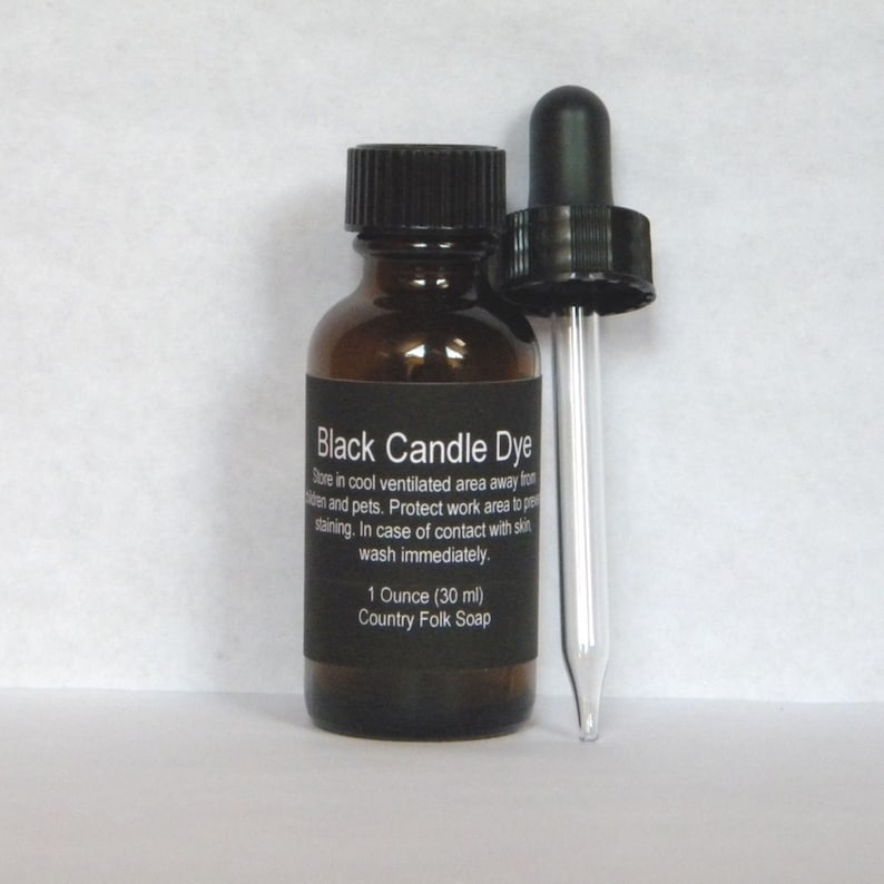 May include: A small brown glass bottle with a black dropper cap. The bottle is labeled "Black Candle Dye" and contains 1 ounce (30 ml) of dye. The label also includes instructions for storage and safety.