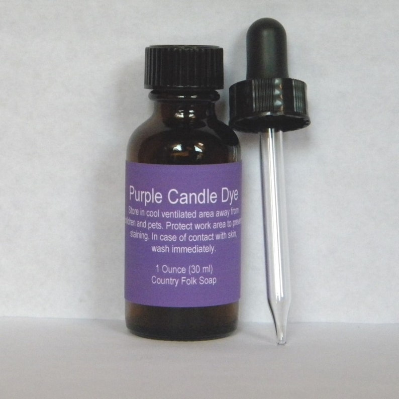 May include: A 1 ounce (30 ml) bottle of purple candle dye with a dropper. The bottle has a purple label with the text "Purple Candle Dye" and instructions for use. The label also includes the text "Country Folk Soap".