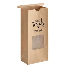 May include: Brown paper bag with a window, a white twine tie, and a black label that says "SWEET treats" with a heart and "EMILY JANE".