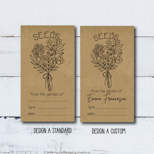 May include: Two brown paper seed packets with a black line drawing of a bouquet of flowers. The text "SEED'S" is at the top of each packet. The left packet has the text "from the garden of:" and blank lines for "type:" and "date:". The right packet has the text "from the garden of: Emma Francesca" and blank lines for "type:" and "date:". The bottom of each packet has the text "DESIGN A STANDARD" and "DESIGN A CUSTOM".