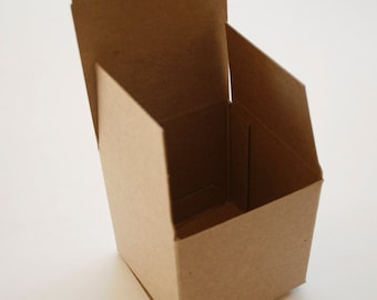 May include: A brown cardboard box with a hinged lid, open and angled to reveal the inside of the box. The box is empty.