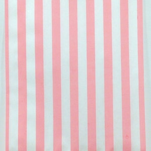 May include: Pink and white striped paper bag. The bag is made of a thin, lightweight paper and has a flat bottom.