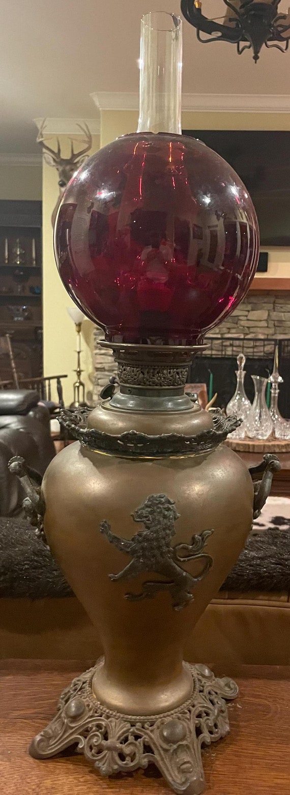 Antique Victorian Oil Lamp Electrified – Ornate Cast Metal Base w/ Heraldic Lion & Cherub Motifs – Cranberry Glass Globe