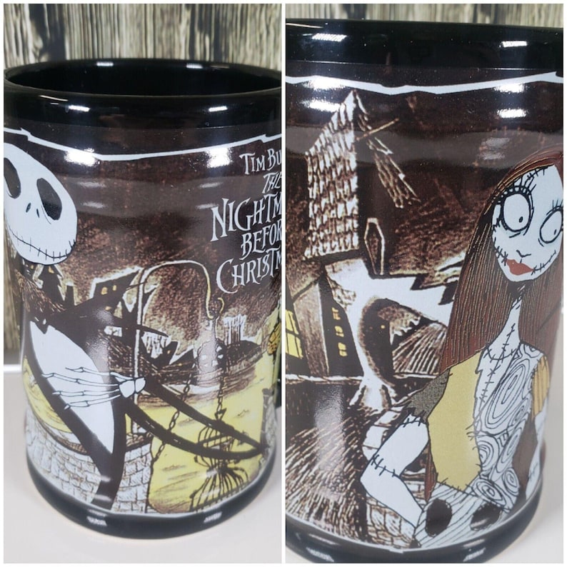 May include: Black ceramic mug featuring characters and scenes from "The Nightmare Before Christmas." The mug has a black rim and base, with illustrations of Jack Skellington and Sally. The mug also has the movie title printed on it.