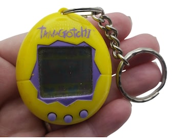 Bandai Tamagotchi Keychain Yellow Electronic Pet Toy 1997 Vintage FOR PARTS ONLY