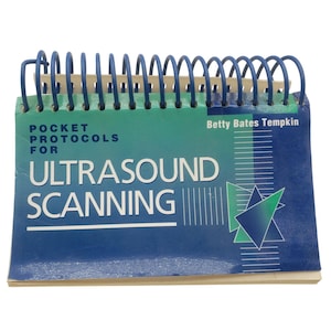 May include: A spiral-bound book titled "Pocket Protocols for Ultrasound Scanning" by Betty Bates Tempkin. The cover has a gradient of blue and green with white text and a geometric design. The spiral binding is blue.