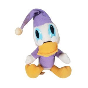 May include: A purple and white plush toy duck wearing a purple sleep cap. The duck has large blue eyes and a yellow beak.