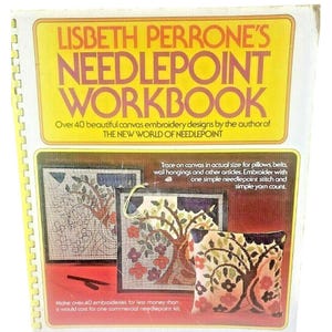 May include: A book titled "Lisbeth Perrone's Needlepoint Workbook" with a yellow cover and a picture of three needlepoint projects. The projects are a pillow, a wall hanging, and a smaller wall hanging. The book cover states that it contains over 40 beautiful canvas embroidery designs by the author of "The New World of Needlepoint".