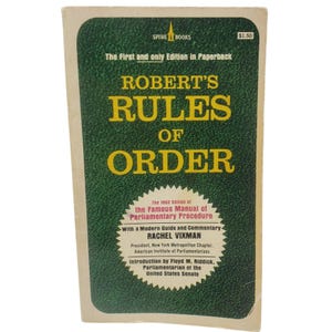 May include: A paperback book titled Robert's Rules of Order with a dark green textured cover and yellow text. The cover features the text The First and only Edition in Paperback, Spire Books, and a white starburst graphic with additional text.