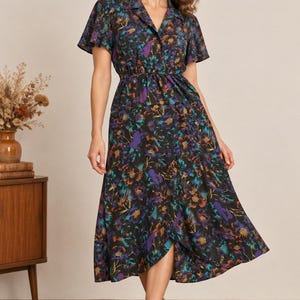 May include: A midi-length dress with a black base featuring a vibrant floral print in shades of purple, teal, and orange. The dress has short flutter sleeves, a collared neckline, a cinched waist, and a wrap-style skirt that falls below the knees.