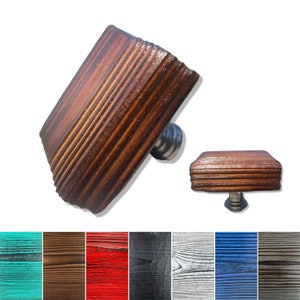 May include: Square wooden cabinet knob with a metal post. The knob is available in ten different colors: teal, brown, red, black, gray, white, blue, and gray.
