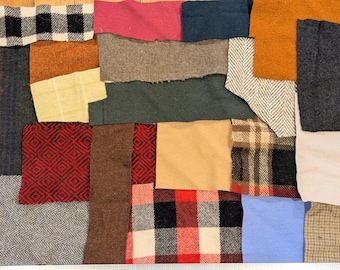 May include: A patchwork of various fabric swatches in different colors and patterns. The arrangement includes squares of black and white plaid, red diamond patterns, and solid colors like orange, blue, and brown. The textures vary from smooth to rough.