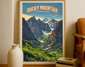 May include: A framed print depicting Rocky Mountain National Park. The artwork showcases a colourful landscape with imposing mountains, a verdant valley, and the text "Rocky Mountain National Park" in orange and white against a blue sky.