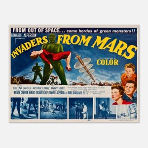 May include: A vintage movie poster for "Invaders From Mars" with a blue and yellow title. The poster features a green alien holding a woman in a red dress, with other figures and text. The poster is photographed in color.