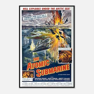 May include: A framed movie poster for "The Atomic Submarine" features a dramatic scene of a submarine under attack. The poster has a black frame and displays the title in large, bold letters, with the tagline "Hell Explodes Under The Arctic Sea!"