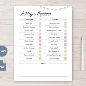 May include: A white printable daily routine chart titled "Ashley's Routine" with morning and evening checklists. The chart includes tasks like "Make Bed," "Eat Dinner," and "Say Goodnight." A pen rests on the right side. The Canva and PDF logos are visible.