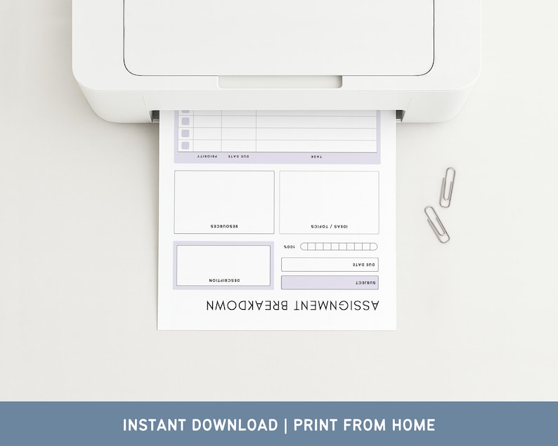 May include: A white printer printing an assignment breakdown sheet with a light purple border. The sheet includes sections for subject, due date, ideas, and description. Two silver paper clips are next to the printed sheet. Text at the bottom reads "INSTANT DOWNLOAD | PRINT FROM HOME."